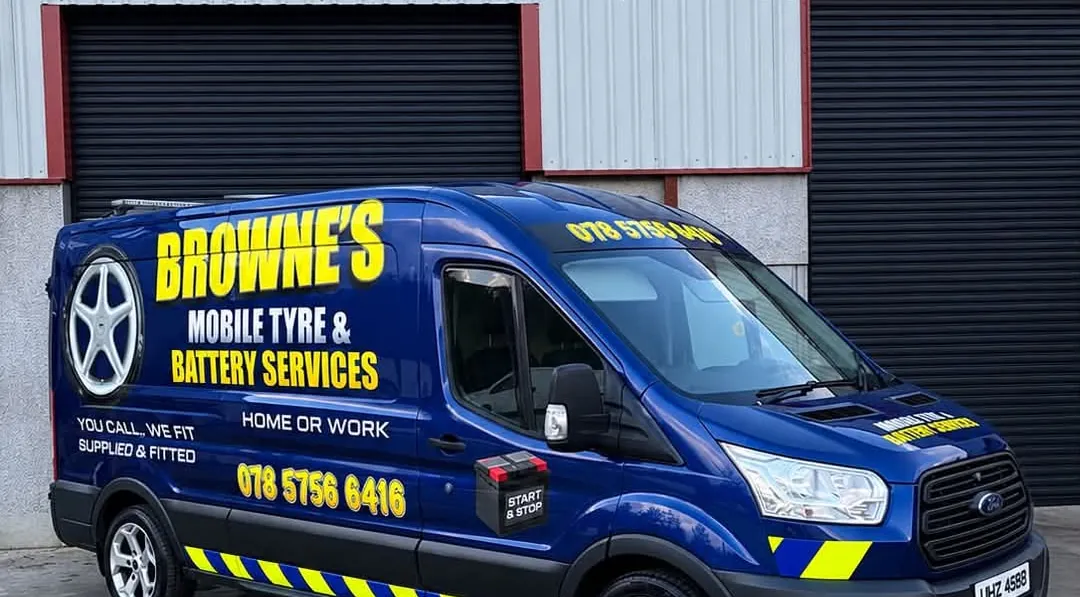 Side of the Browne's van showing the phone number, You call we fit, Home or work and Supplied and fitted lettering